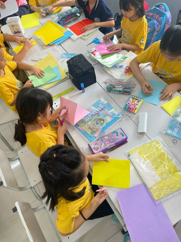 Students taking part in a paper craft workshop