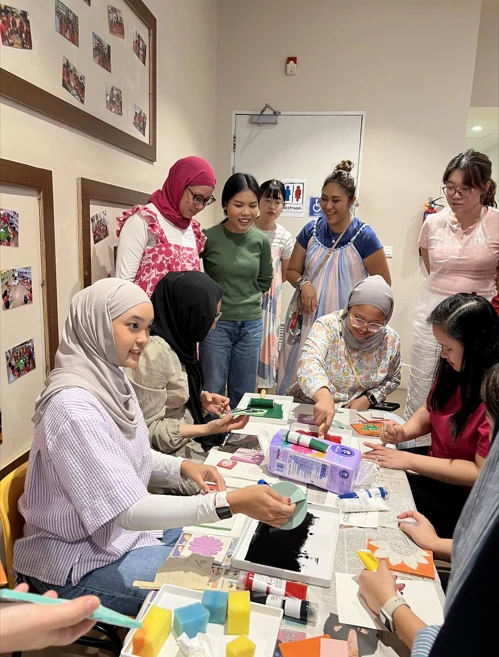 Participants collaborating around a table during a Collartive creative workshop